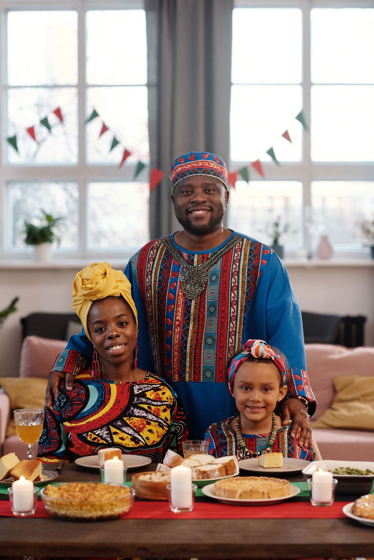 African family in traditional attire sharing a festive meal together, celebrating culture and heritage