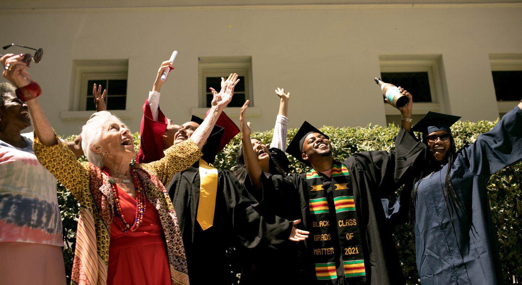 Graduates celebrating together at graduation ceremony